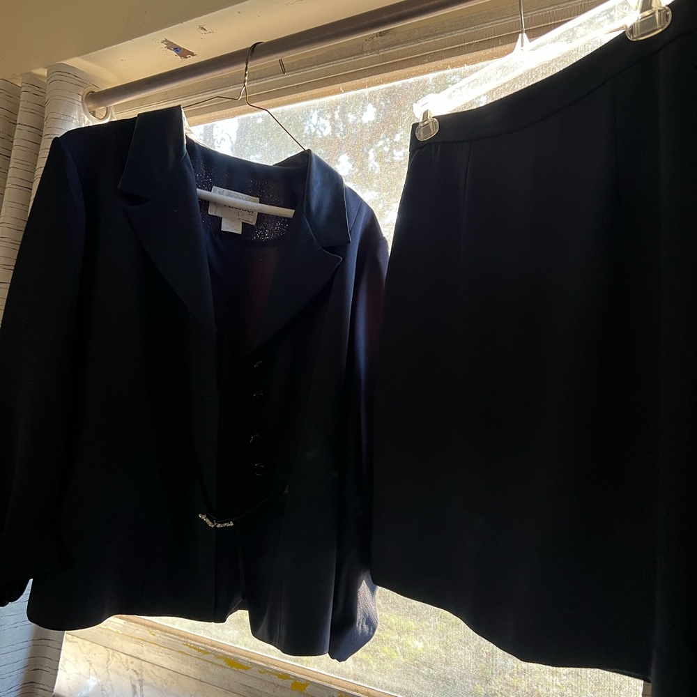 Navy women’s suit jacket and skirt